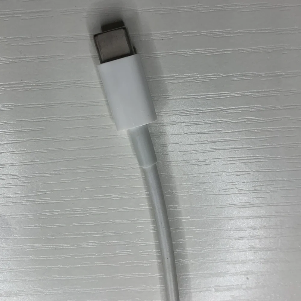 white MacBook adapter